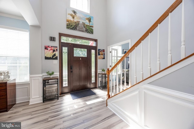2200 Summerdale Ln, Linfield, PA 19468 - entrance foyer featuring wood finished floors, a decorative wall, stairway, plenty of natural light, and a high ceiling