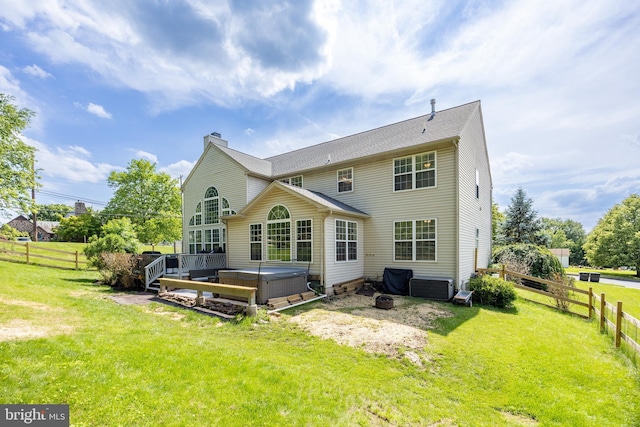 2200 Summerdale Ln, Linfield, PA 19468 - rear view of property with a hot tub, a chimney, and a deck