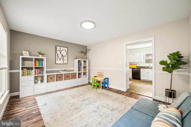 1576 Delong Dr, Downingtown, PA 19335 - rec room featuring wood finished floors, a sink, and baseboards
