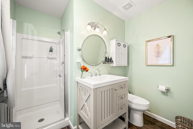 1576 Delong Dr, Downingtown, PA 19335 - full bath with a shower stall, wood finished floors, baseboards, vanity, and toilet