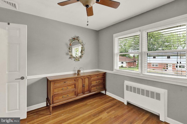 102 Radcliffe Ave, Reading, PA 19609 - bedroom featuring radiator, wood finished floors, baseboards, and a ceiling fan