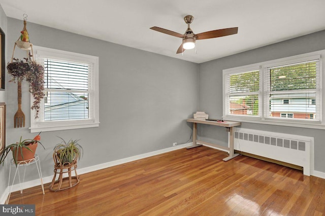 102 Radcliffe Ave, Reading, PA 19609 - unfurnished room with radiator, baseboards, light wood-style flooring, and ceiling fan