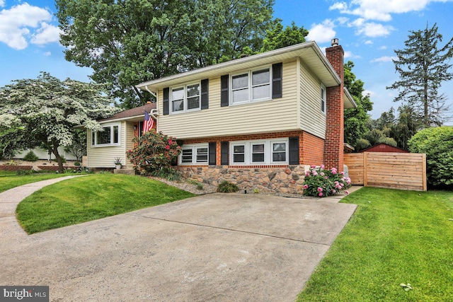 102 Radcliffe Ave, Reading, PA 19609 - tri-level home featuring a chimney and brick siding