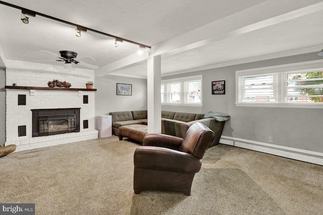 102 Radcliffe Ave, Reading, PA 19609 - living room with carpet flooring, a ceiling fan, crown molding, a fireplace, and a baseboard radiator