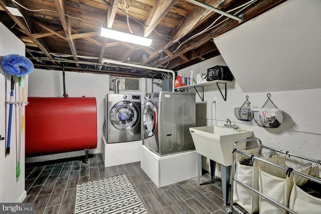102 Radcliffe Ave, Reading, PA 19609 - washroom with heating fuel, washer and clothes dryer, and wood tiled floors