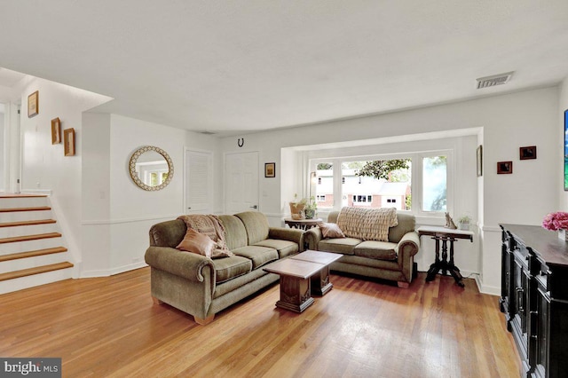 102 Radcliffe Ave, Reading, PA 19609 - living area with light wood-style flooring, stairs, and baseboards