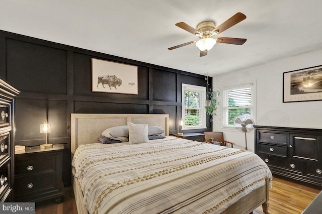 102 Radcliffe Ave, Reading, PA 19609 - bedroom featuring a decorative wall, light wood-style floors, and ceiling fan