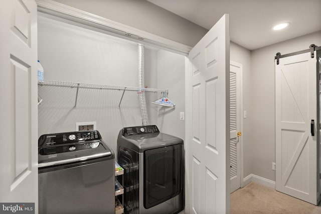 11917 Hayes Station Way, Manassas, VA 20109 - laundry room featuring washer and dryer, a barn door, carpet flooring, baseboards, and recessed lighting