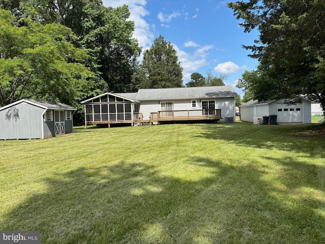 29799 Allen Rd, Mechanicsville, MD 20659 - rear view of house featuring a sunroom, a wooden deck, a yard, a garage, and cooling unit