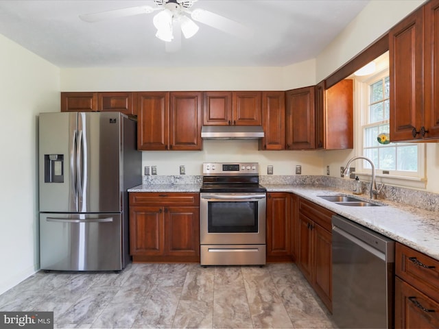 1204 S Fork Dr, Front Royal, VA 22630 - kitchen with stainless steel appliances, under cabinet range hood, a sink, a ceiling fan, and light stone countertops