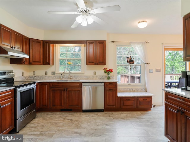 1204 S Fork Dr, Front Royal, VA 22630 - kitchen with stainless steel appliances, under cabinet range hood, a sink, and healthy amount of natural light