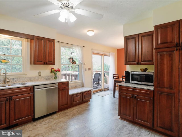 1204 S Fork Dr, Front Royal, VA 22630 - kitchen with stainless steel appliances, a sink, light countertops, and a ceiling fan