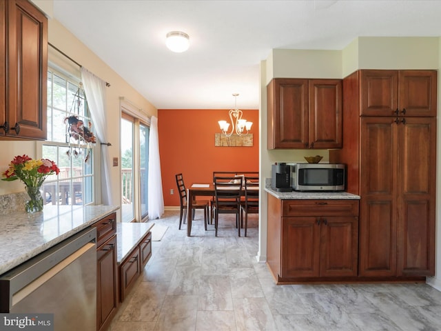1204 S Fork Dr, Front Royal, VA 22630 - kitchen featuring appliances with stainless steel finishes, a chandelier, light stone counters, and brown cabinetry