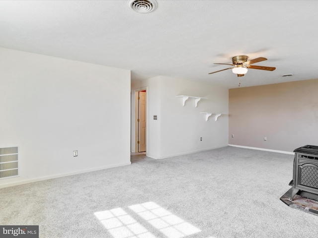 1204 S Fork Dr, Front Royal, VA 22630 - unfurnished living room featuring a wood stove, ceiling fan, carpet floors, and baseboards