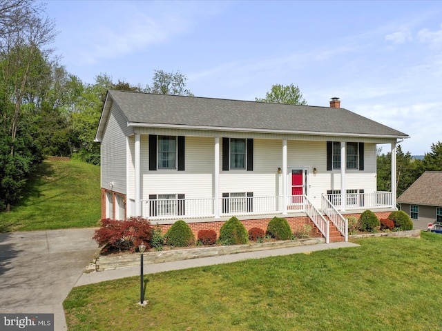 1204 S Fork Dr, Front Royal, VA 22630 - raised ranch with covered porch, an attached garage, concrete driveway, a chimney, and a front lawn