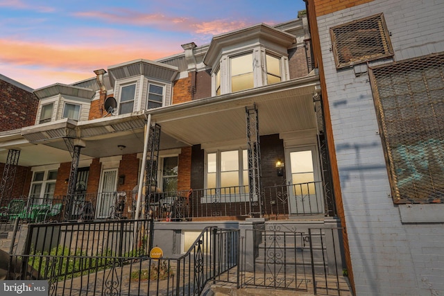 308 S 56th St, Philadelphia, PA 19143 - townhome / multi-family property with brick siding and a porch