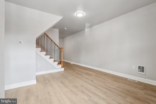 308 S 56th St, Philadelphia, PA 19143 - unfurnished living room with light wood-type flooring, stairs, and baseboards