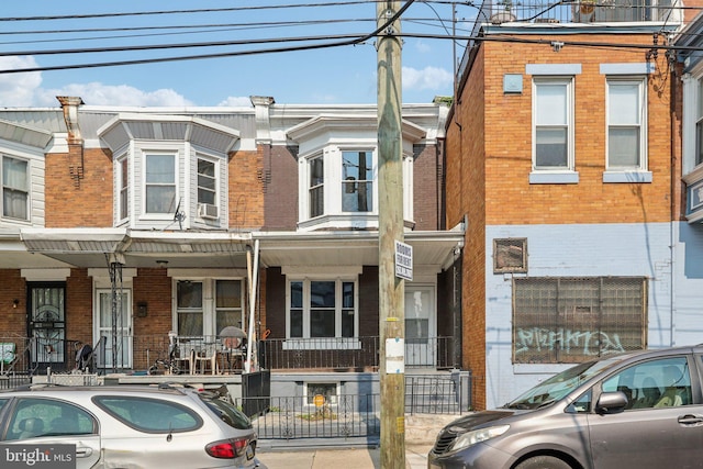 308 S 56th St, Philadelphia, PA 19143 - townhome / multi-family property featuring brick siding and a porch