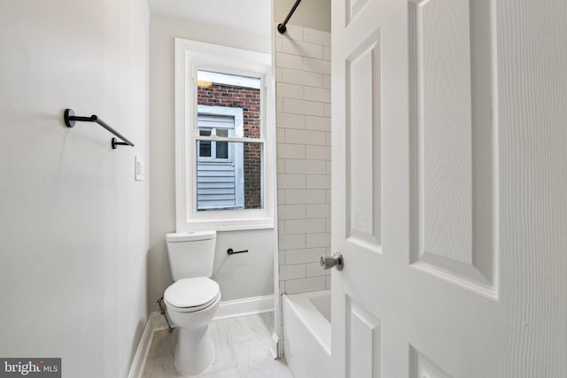 308 S 56th St, Philadelphia, PA 19143 - full bathroom with toilet, baseboards, marble look tile flooring, and shower / washtub combination