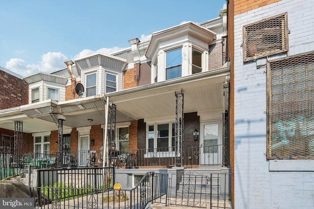 308 S 56th St, Philadelphia, PA 19143 - view of front facade with a porch and brick siding
