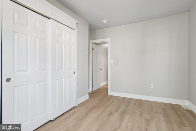 308 S 56th St, Philadelphia, PA 19143 - unfurnished bedroom featuring light wood-style floors, baseboards, and a closet