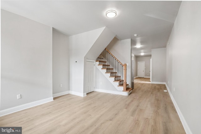 308 S 56th St, Philadelphia, PA 19143 - stairs featuring wood finished floors and baseboards