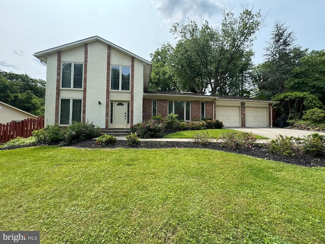 9207 Bois Ave, Vienna, VA 22182 - view of front of home featuring an attached garage, concrete driveway, brick siding, and stucco siding
