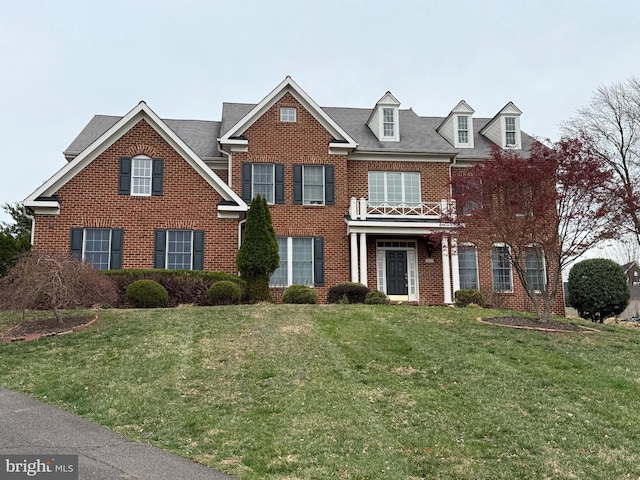 6634 Brawner St, Mclean, VA 22101 - colonial inspired home featuring brick siding, a front yard, and a balcony