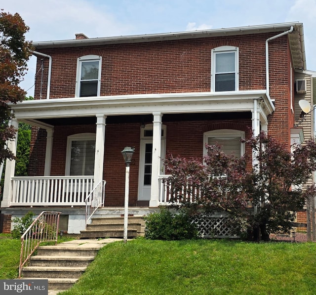 120 S Morwood Ave, Reading, PA 19609 - view of front of property with brick siding, a porch, and a front yard