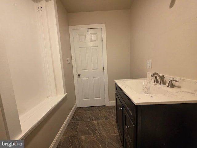 120 S Morwood Ave, Reading, PA 19609 - bathroom featuring baseboards, vanity, and marble finish flooring