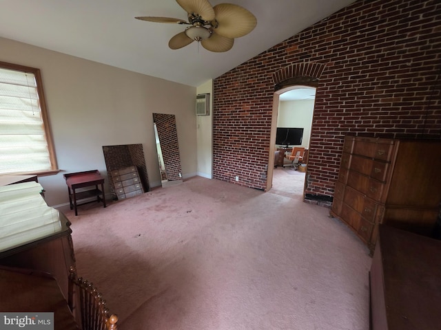120 S Morwood Ave, Reading, PA 19609 - unfurnished living room featuring vaulted ceiling, brick wall, ceiling fan, an office area, and a wall mounted AC