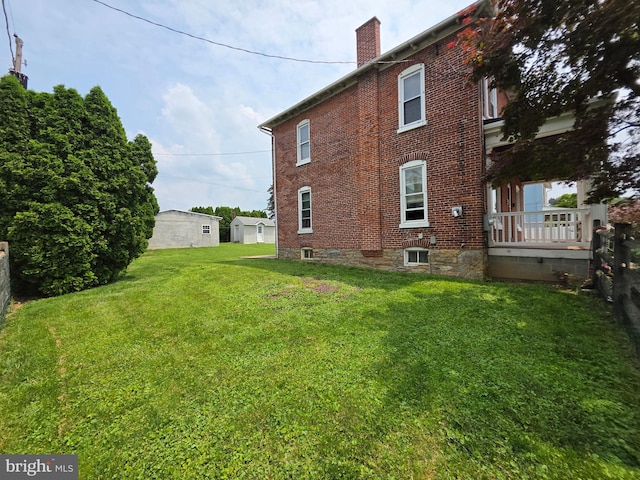 120 S Morwood Ave, Reading, PA 19609 - view of home's exterior with a chimney, brick siding, and a yard
