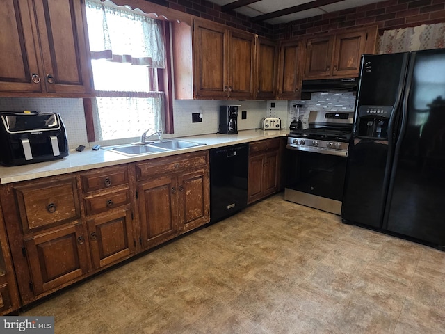 120 S Morwood Ave, Reading, PA 19609 - kitchen featuring black appliances, under cabinet range hood, a sink, light countertops, and tasteful backsplash