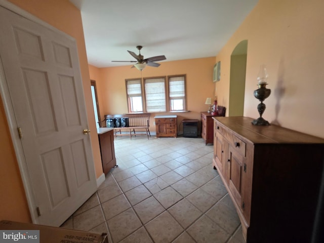 120 S Morwood Ave, Reading, PA 19609 - kitchen with light tile patterned floors, ceiling fan, and arched walkways
