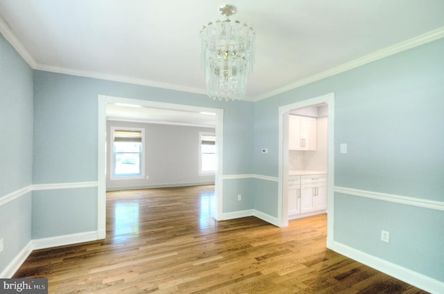 1 Wembley Dr, Mount Laurel, NJ 08054 - empty room with a chandelier, baseboards, wood finished floors, and crown molding