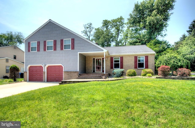 1 Wembley Dr, Mount Laurel, NJ 08054 - split level home featuring a garage, concrete driveway, a front yard, and brick siding