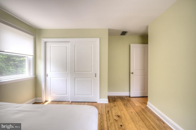 1 Wembley Dr, Mount Laurel, NJ 08054 - unfurnished bedroom featuring light wood-type flooring, baseboards, and a closet