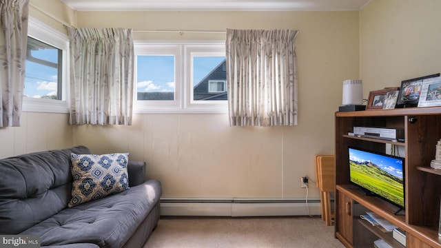 126 Heartwood Rd, Levittown, PA 19056 - living area with a baseboard heating unit and light colored carpet