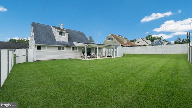 126 Heartwood Rd, Levittown, PA 19056 - back of house with a patio and roof with shingles