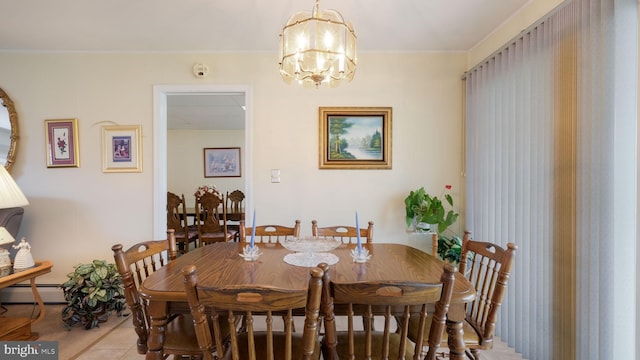 126 Heartwood Rd, Levittown, PA 19056 - dining room with a chandelier, light tile patterned floors, a baseboard heating unit, and ornamental molding