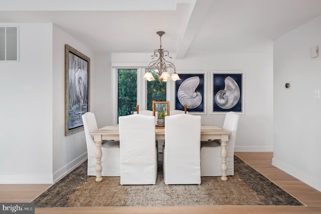 32-B Long Beach Blvd, Long Beach Township, NJ 08008 - dining room featuring a chandelier, wood finished floors, baseboards, and beam ceiling