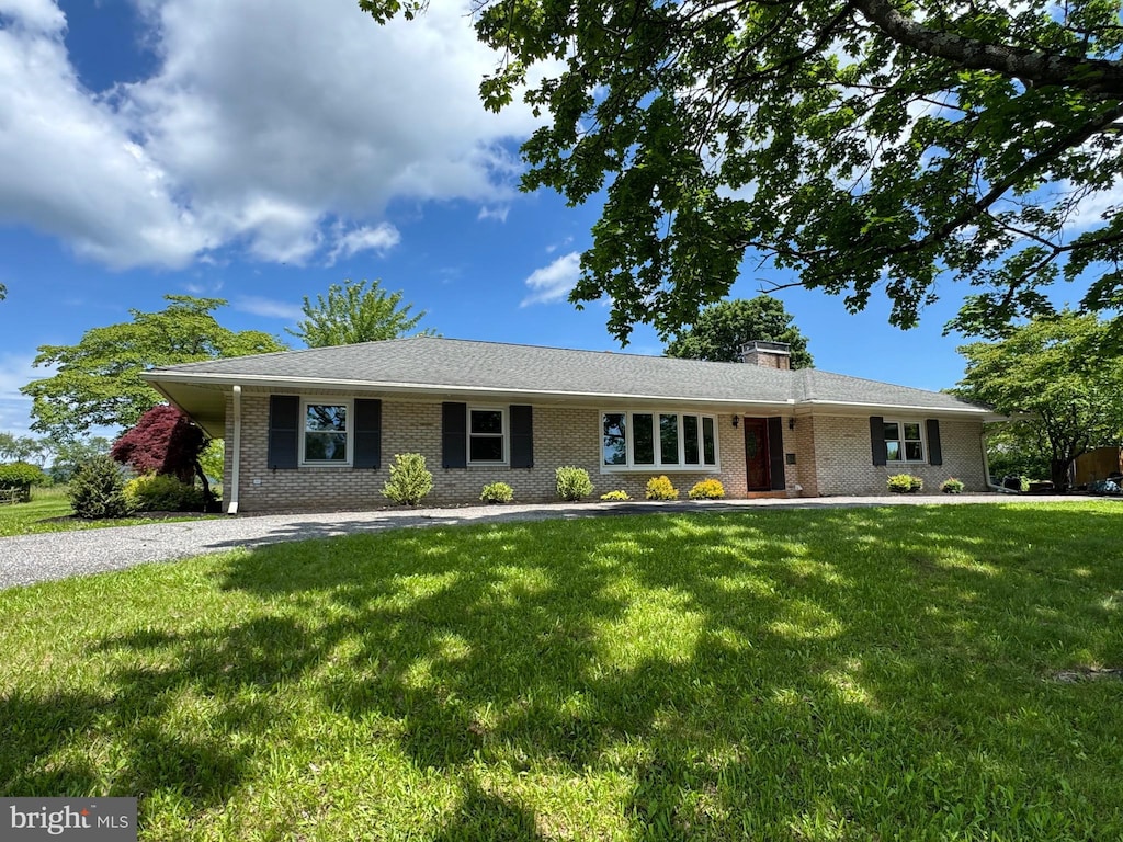 106 Locust Way, Carlisle, PA 17015 - ranch-style home with a front lawn, brick siding, and a chimney