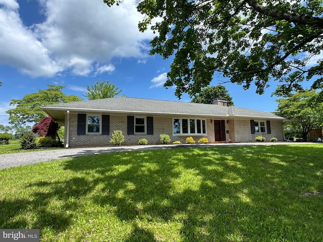 106 Locust Way, Carlisle, PA 17015 - ranch-style home with a front lawn, brick siding, and a chimney
