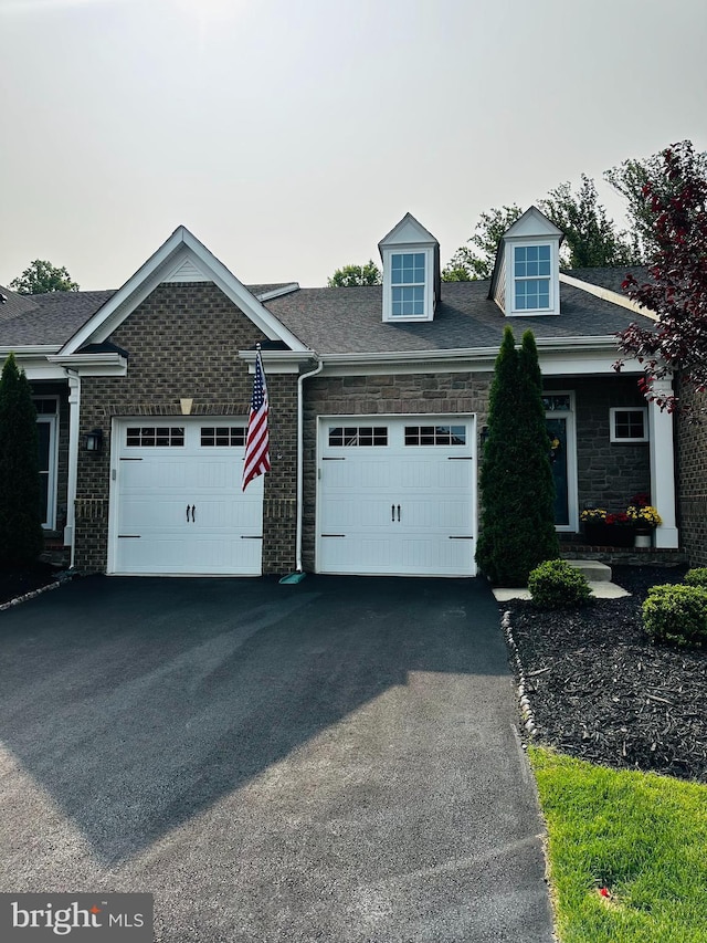2757 Vardon Ln, Ellicott City, MD 21042 - view of front of house featuring a garage, asphalt driveway, and stone siding