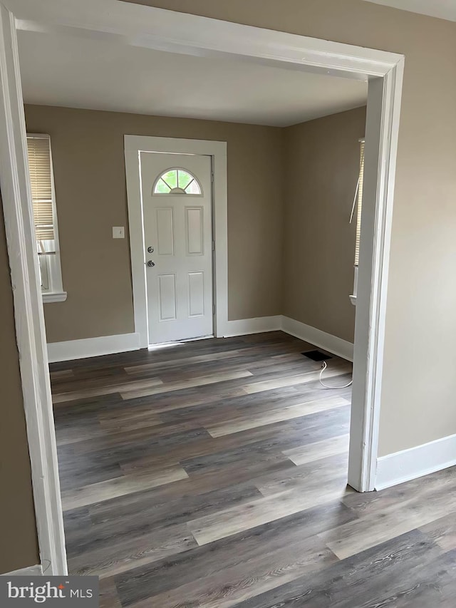1105 N Chestnut St, Paulsboro, NJ 08066 - entrance foyer with baseboards and dark wood-style floors