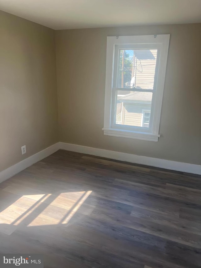 1105 N Chestnut St, Paulsboro, NJ 08066 - unfurnished room featuring baseboards and wood finished floors
