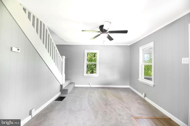 223 One Mile Run Rd, Philipsburg, PA 16866 - unfurnished living room with stairs, ceiling fan, baseboards, and carpet