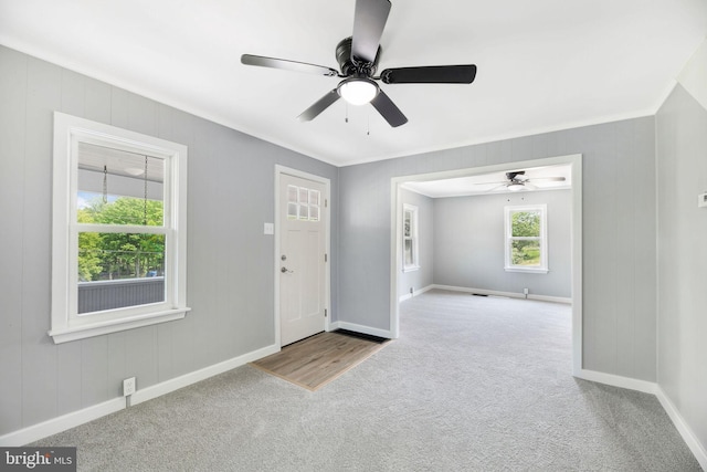 223 One Mile Run Rd, Philipsburg, PA 16866 - carpeted foyer featuring baseboards, ornamental molding, and ceiling fan