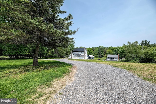 223 One Mile Run Rd, Philipsburg, PA 16866 - view of front of house featuring gravel driveway, metal roof, and a view of trees