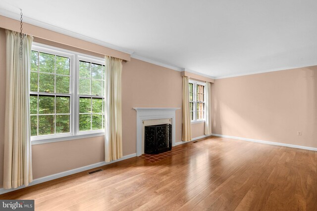4849 Carriagepark Rd, Fairfax, VA 22032 - unfurnished living room featuring light wood-style flooring, a fireplace with flush hearth, baseboards, and ornamental molding